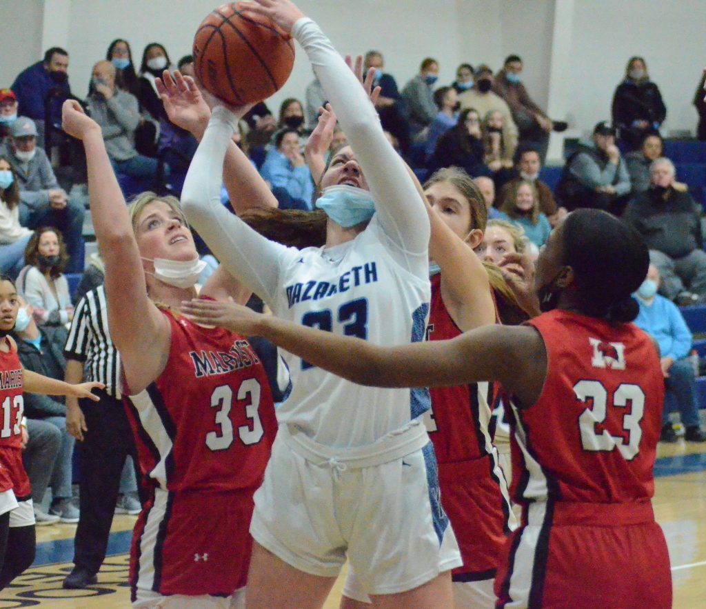 Sophomore Danni Scully of Nazareth is triple-teamed by Marist in a 53-42 victory in LaGrange Park on Jan. 19. Photo by Jeff Vorva