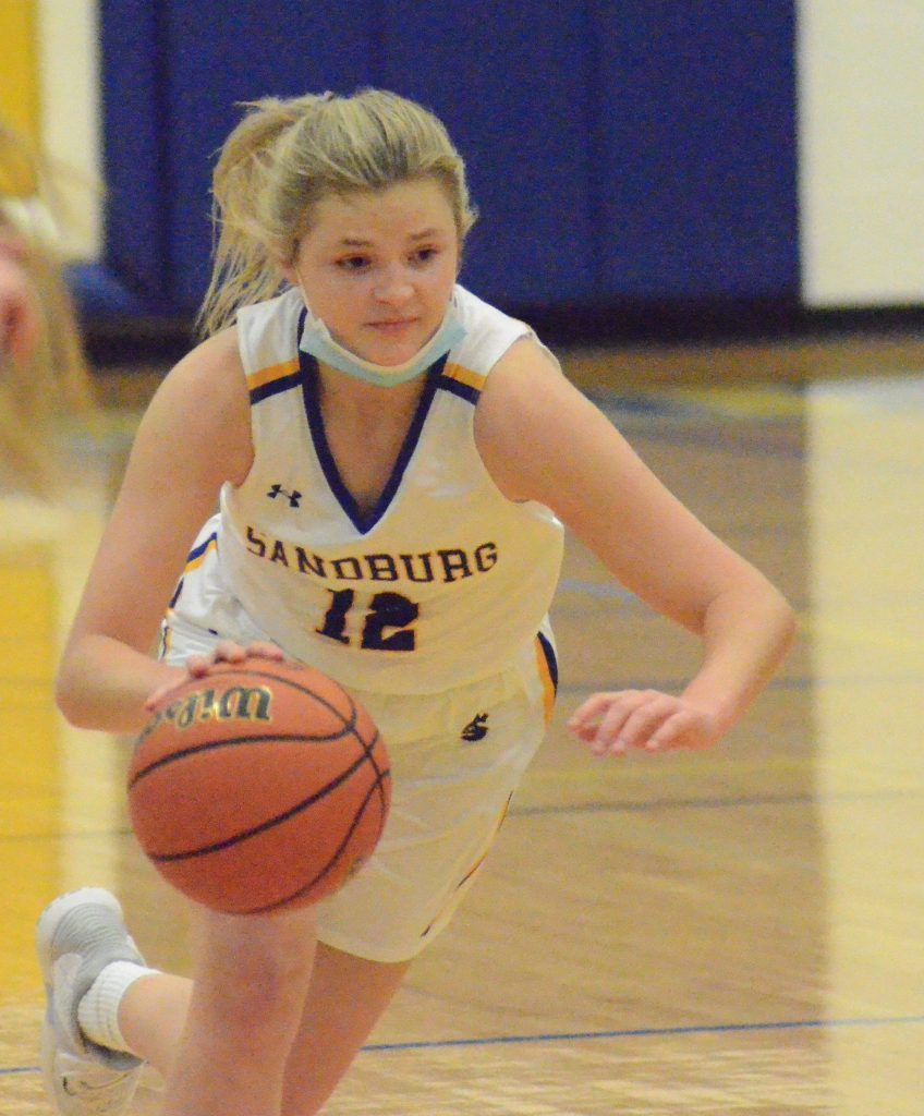 Sandburg’s Claire Callaghan dribbles during the opening round of the Eagles own holiday tournament on Dec. 27. The Eagles finished second in the tournament. Photo by Jeff Vorva