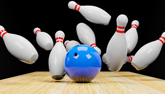 3d render of a bowling strike with skittles and a ball.Digital image illustration.