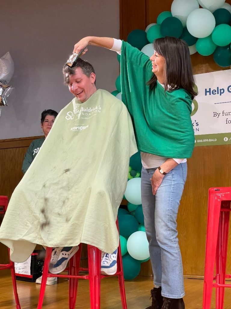 Most Holy Redeemer Principal Dan Turney had his head shaved by Evergreen Park Mayor Kelly Burke during the school's St. Baldrick's event on Friday, March 11. (Photos by Kelly White)
