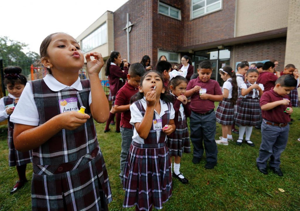 Something as simple as girls and boys blowing bubbles (pictured here at Queen of the Universe School in 2018) may return to local Catholic schools this spring, as Archdiocesan officials have relaxed mask mandates in the wake of COVID-19 numbers showing a sharp decline. --Supplied photo
