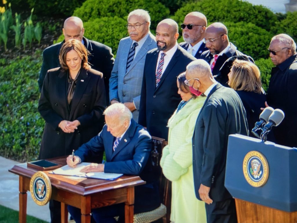 President Joe Biden signs the Emmett Till Anti-Lynching Act on March 29 in the White House Rose Garden. (Photo courtesy of The Raben Group)