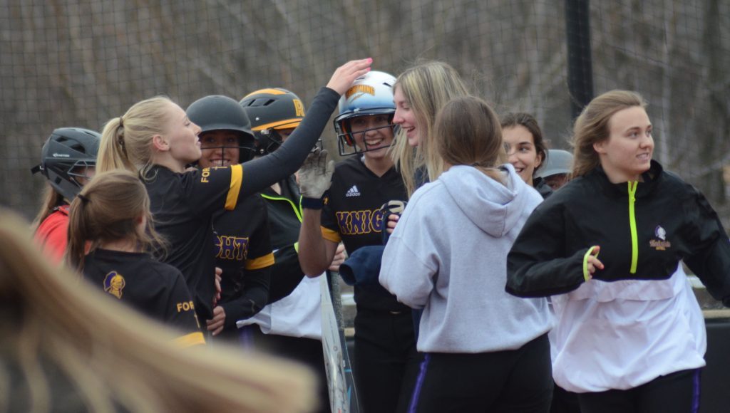 Lizzie Sedekis (white helmet) is congratulated by her Chicago Christian teammates after a home run against Timothy Christian on April 6 in Palos Heights. Photo by Jeff Vorva