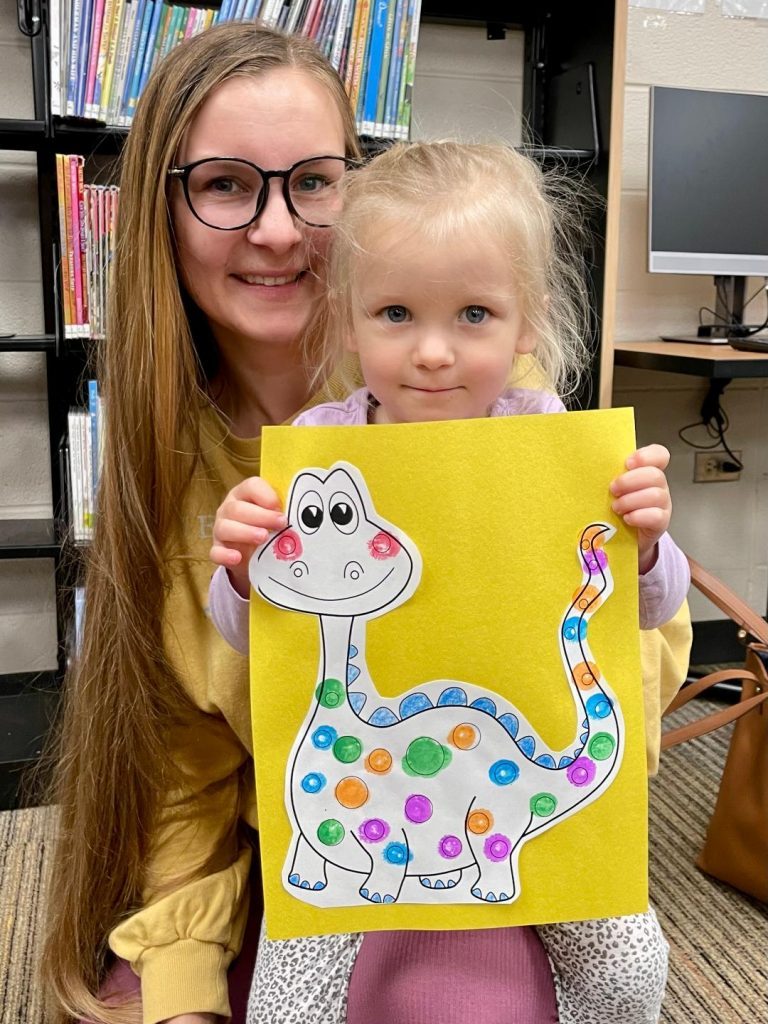 Monika Dysarski and her daughter, Marta, 2, of Worth, had fun together at the Worth Public Library's Dinosaur Storytime on Tuesday. (Photos by Kelly White)