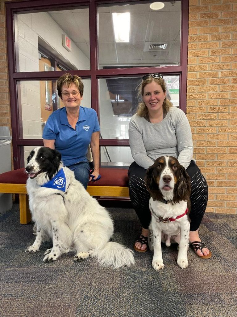 Sharon Vojtek, of Palos Heights, and her dog, Spirit, and Meghan Shanahan, of Chicago, and her dog, Keegan, were part of the Oak Lawn Public Library's Finals Week Puppy Break on May 19. (Photos by Kelly White)
