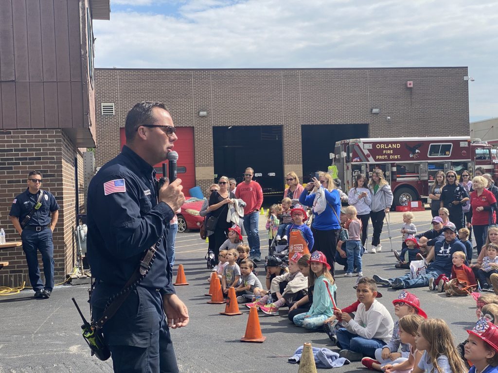 regional orland fire open house 2022 Orland fire fighter Mark Hogan teaching the crowd about fire safety and escape plan