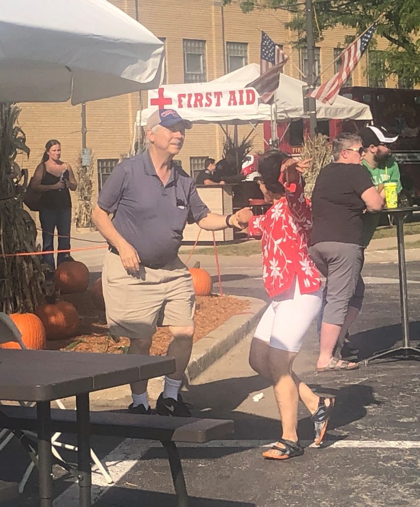 Martin Franek, of Oak Lawn, and his partner dance to the sounds of Electricland during the village’s Fall Music Festival. (Photos by Dermot Connolly)