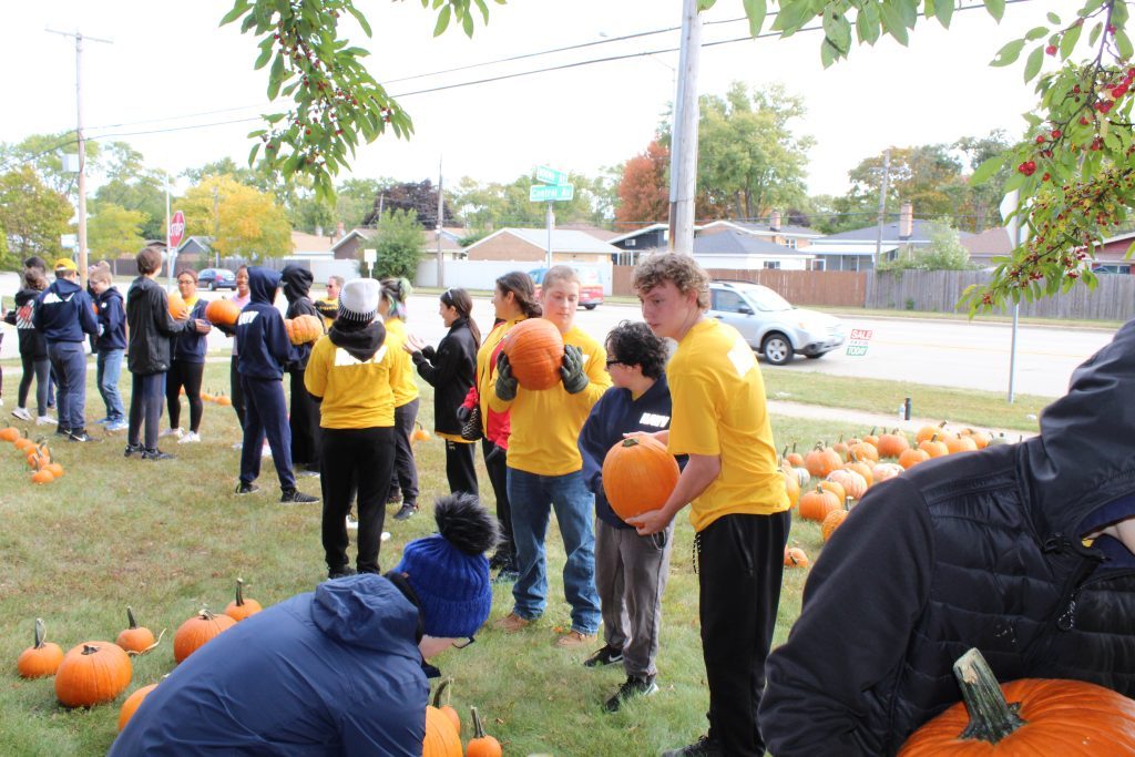 Students from the U.S. Navy JROTC program and National Honor Society from Richards High School volunteered to help First United Methodist Church of Oak Lawn set up its pumpkin patch. (Supplied photos)