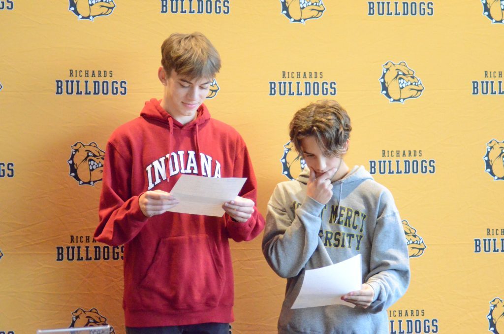 Owen Forberg, left, and Josh Smith of Richards examine their letters-of-intent that they signed on Nov 9. Photo by Jeff Vorva