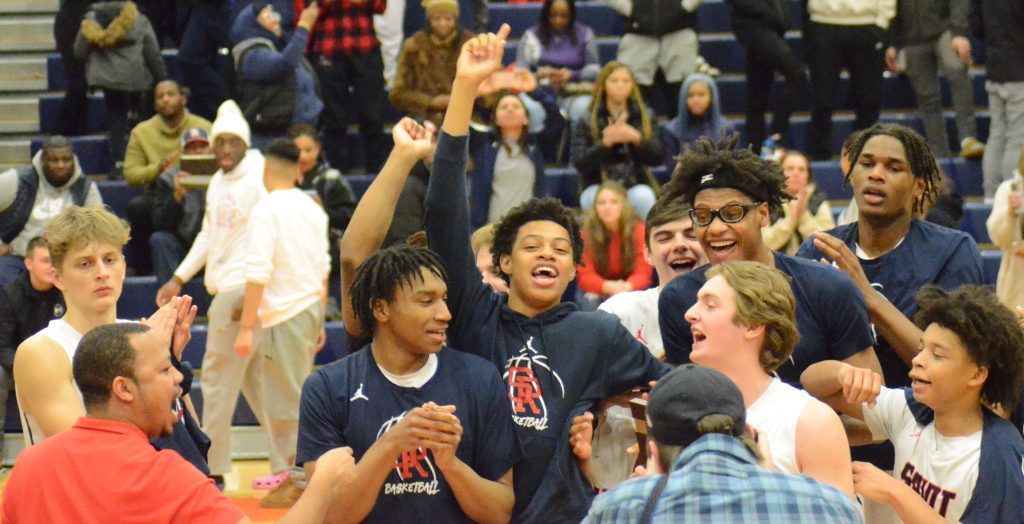 St. Rita celebrates its Stagg Regional title Friday night in Palos Hills. The Mustangs were one of 10 Chicago Catholic League teams to win regional titles this season. Photo by Jeff Vorva