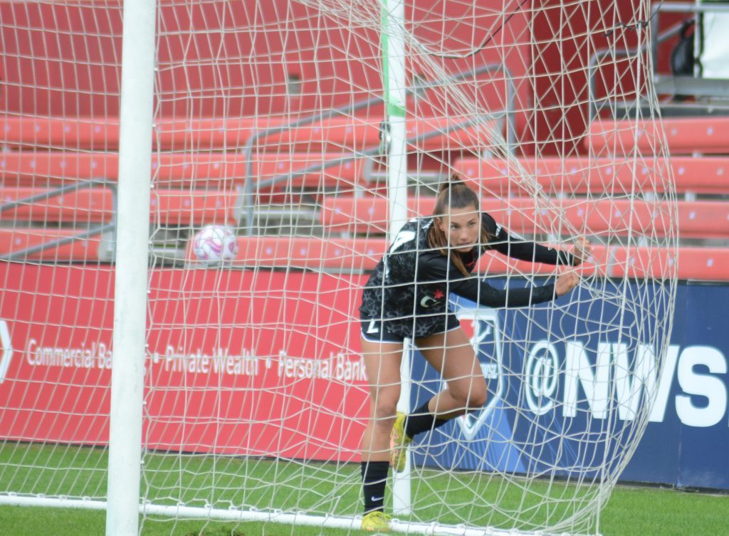 Chicago Red Stars’ rookie Jenna Bike’s momentum took her into the net during a 2-1 loss to Houston on April 1. Photo by Jeff Vorva