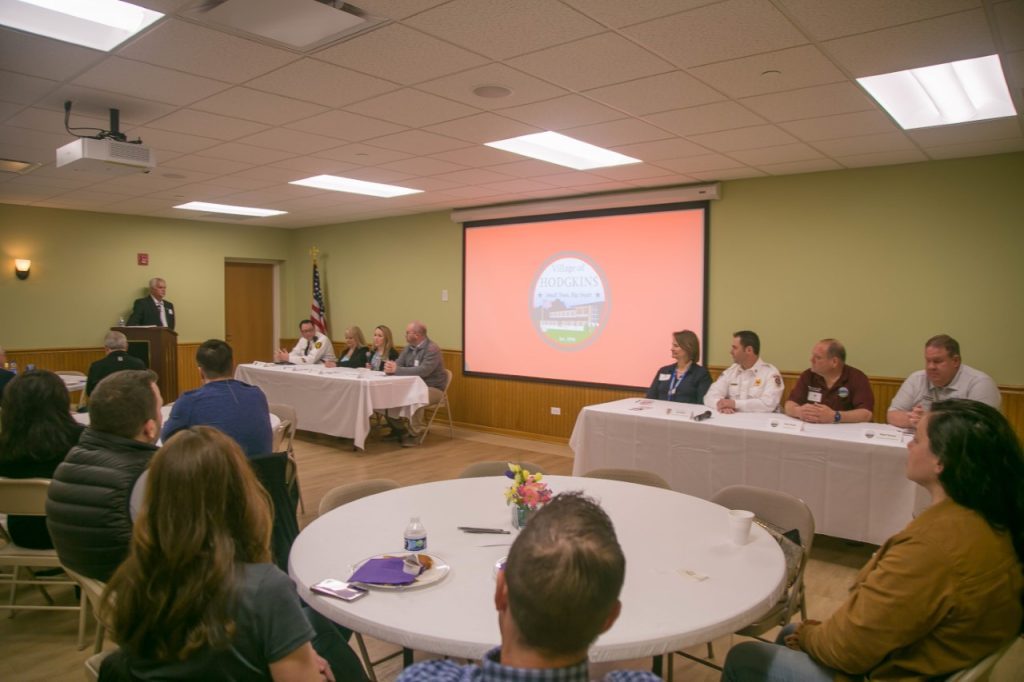 Village, park, library, and school leaders speak at the business breakfast. (Photo by Carol McGowan)