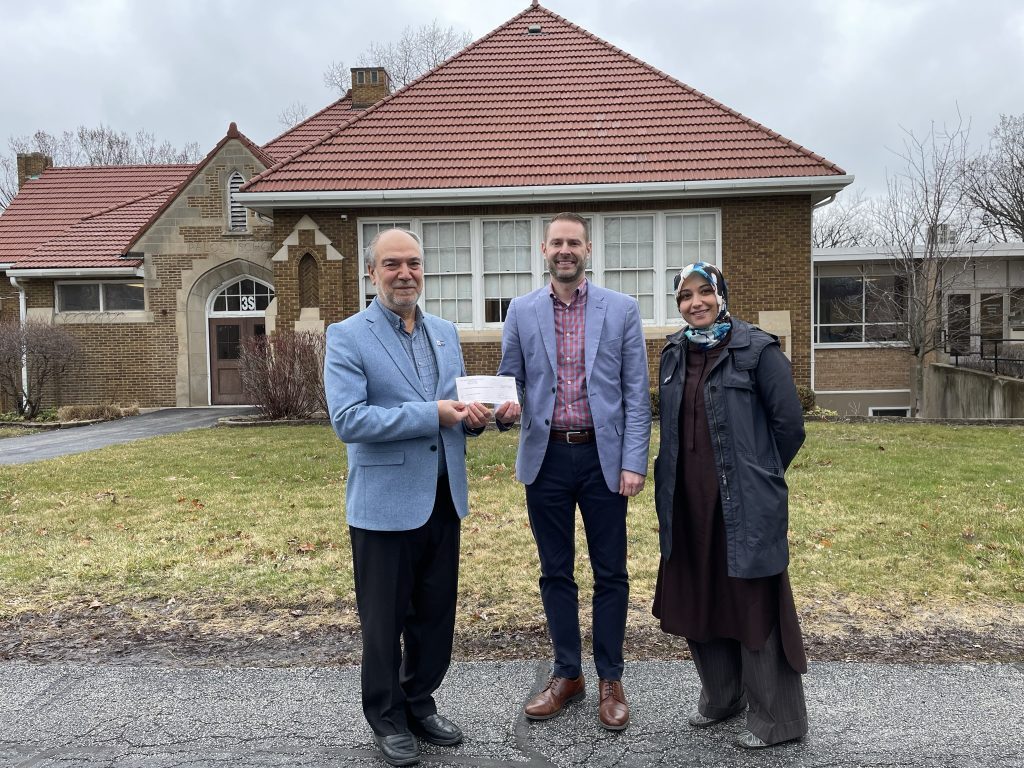 Supt. Dr. Anthony Scarsella presents a check to Zakat Foundation of America Director Khalil Demir to help victims of earthquakes in Turkey and Syria. (Supplied photo) 
