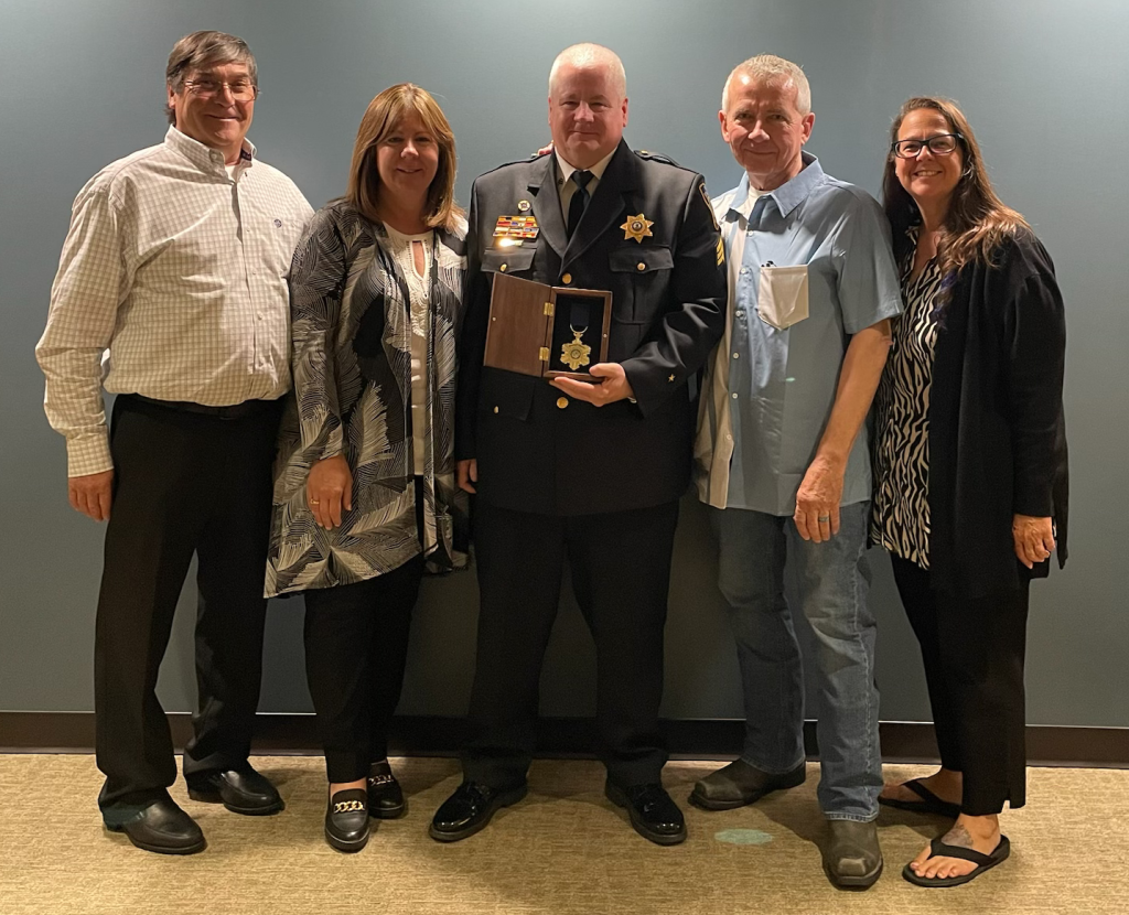 Bridgeview Police Sgt. Jason Stein (center) shares his Medal of Honor moment with brother-in law Mark Calcut (left), sister Sherri Calcut, stepdad Roger Shell and sister Theresa Hausmann. (Supplied photo) 