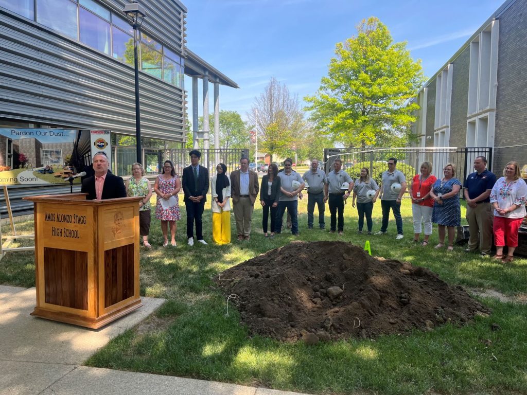 Dr. Robert J. Nolting, District 230 superintendent, speaks at the June 2 ceremonial groundbreaking for a $15.5 million expansion project at Stagg High School, 8015 W. 111th St., with school board members, teachers and students behind him. (Photo by Dermot Connolly)