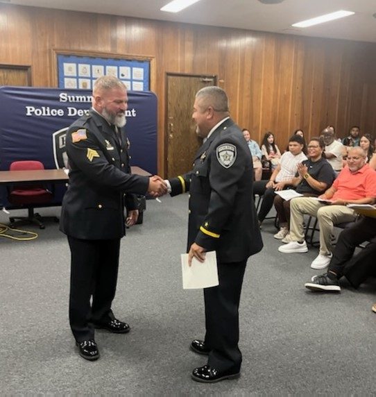 Summit Police Chief Mel Ortiz (right) congratulates Officer Kevin Janettas on his promotion to sergeant. (Photo courtesy of Village of Summit)  