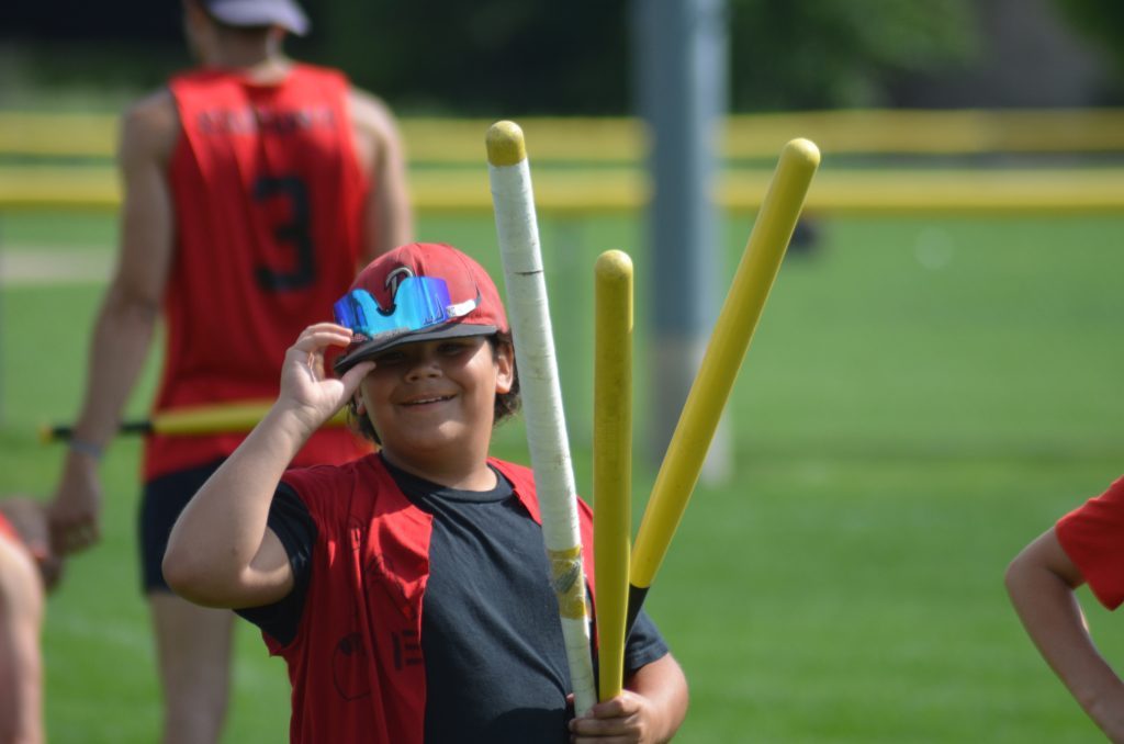Everett Seitz of the Palos Elite, wields three bats before heading to the plate in the World Wiffle Ball Tournament on July 15. Photo by Jeff Vorva