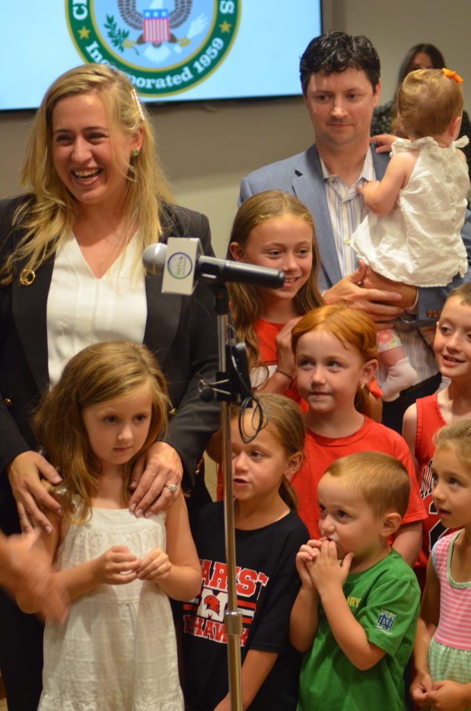 Shannon Harvey (left) brought her daughter, Tess, plus several nieces, nephews and her husband, Pat, to join her as she was sworn in as city clerk in Palos Heights on Aug. 15. (Photo by Jeff Vorva)