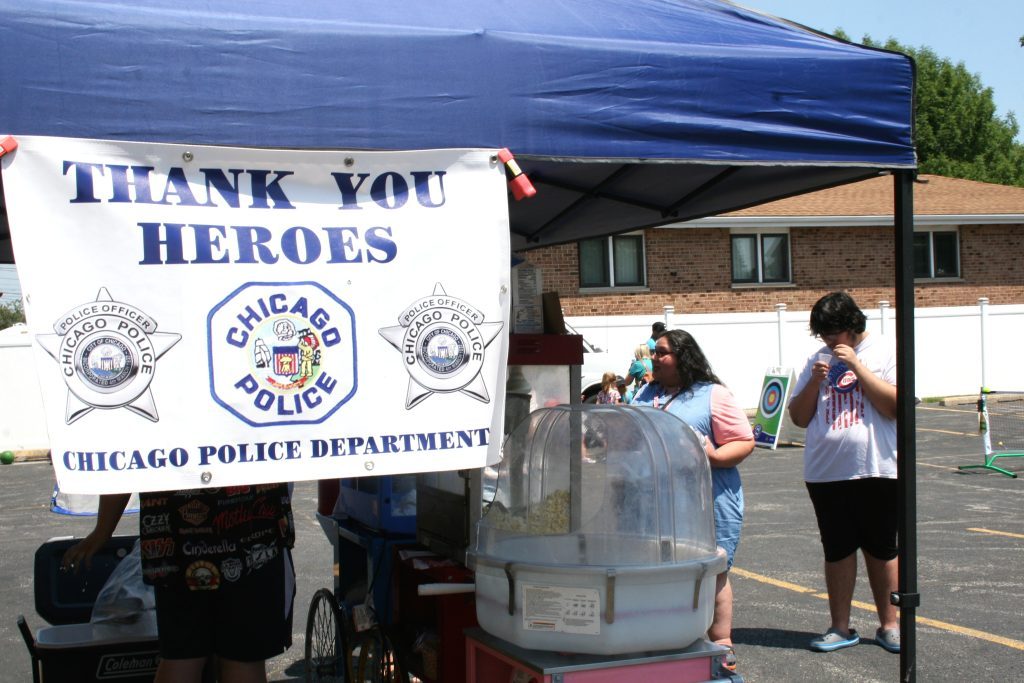 The Garfield Ridge Neighborhood Watch organization held its inaugural "Meet Your Beat 811" community event Saturday at St. Faustina Hall and parking lot. The event was held to salute police and firefighters. Photos by Joe Boyle