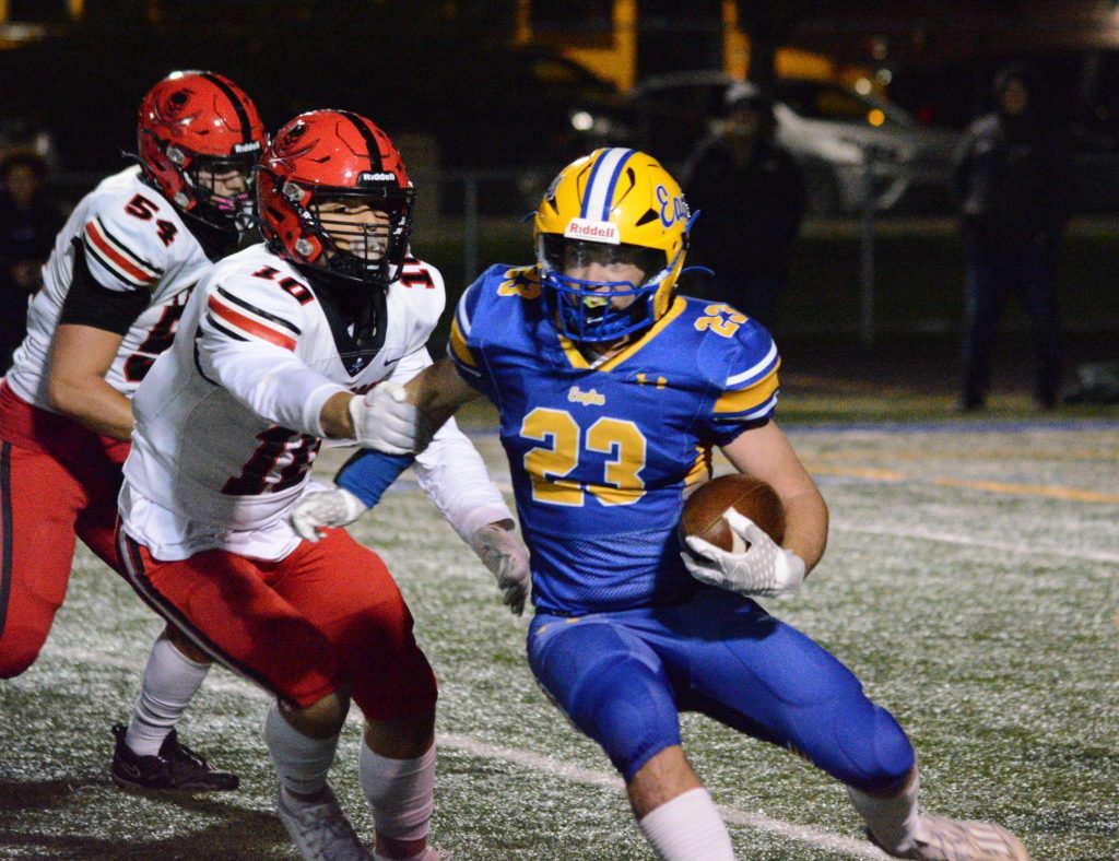 Sandburg freshman running back Quinn Durkin carries the ball during the Eagles’ 42-27 win over Bolingbrook on Oct. 6. Photo by Jason Maholy