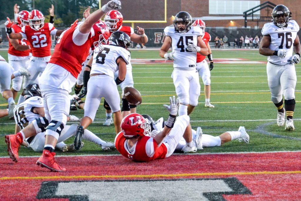 Marist running back John McAuliffe scores the first touchdown of the night during the RedHawks’ 21-20 loss to Joliet Catholic on Sept. 29. Photo by Xavier Sanchez
