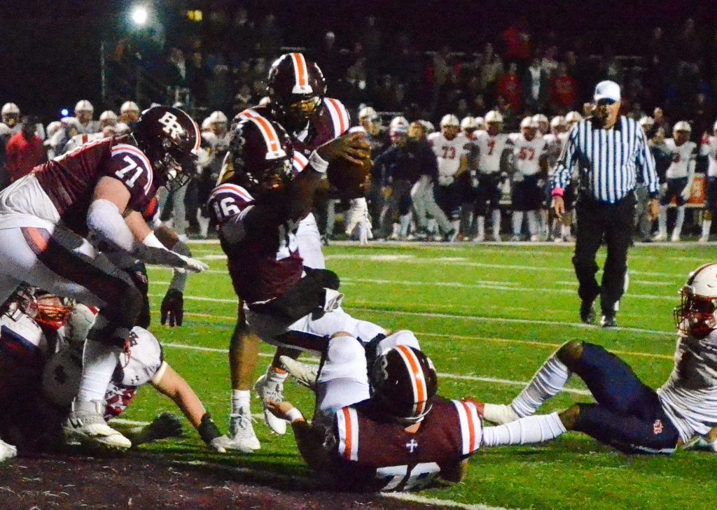 Brother Rice quarterback Marcus Brown punches it for a touchdown in a 42-21 win over St. Rita on Oct. 20. Photo by Xavier Sanchez