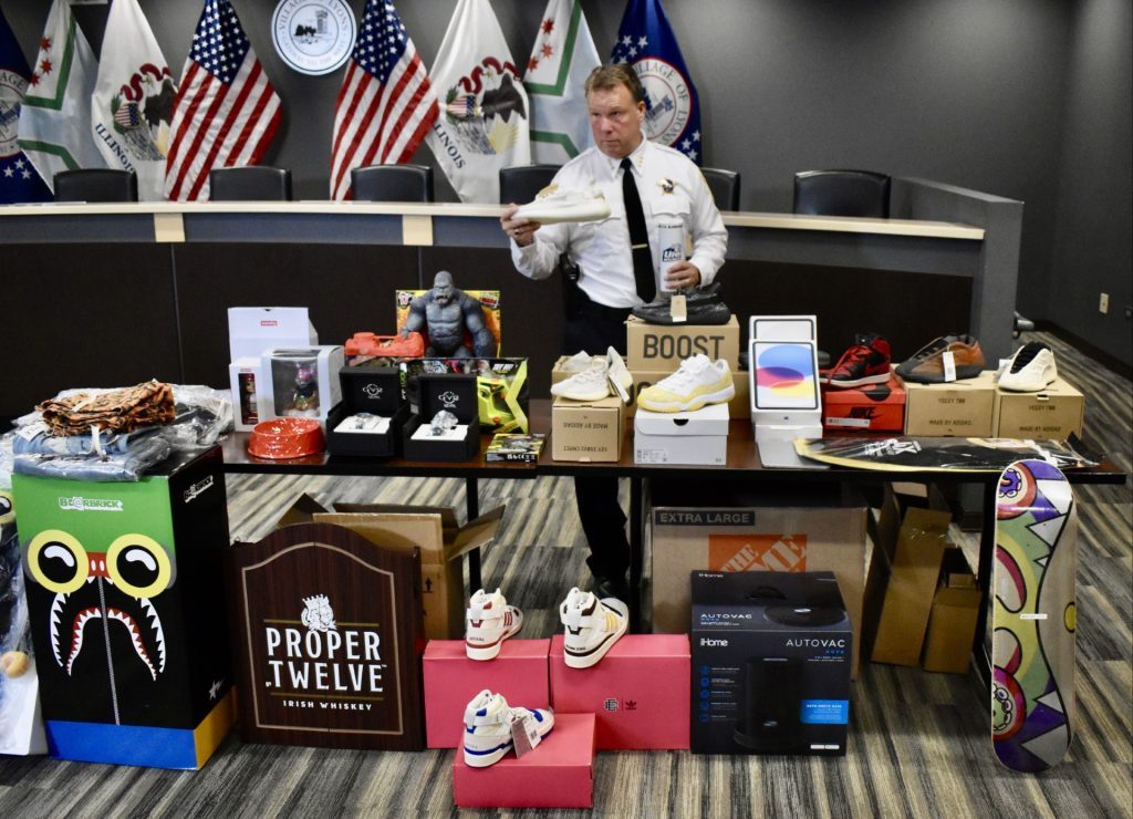 Lyons Police Chief Thomas Herion with some examples of the items stolen in the $5 million heist. (Photo by Steve Metsch)