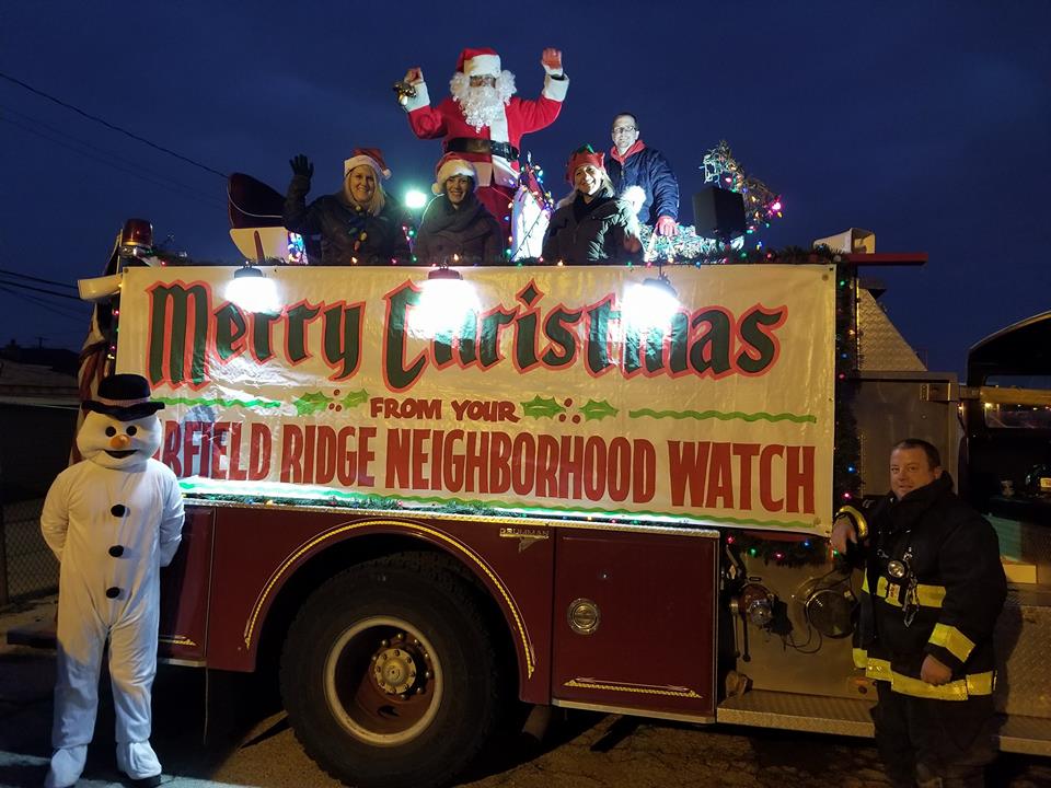 Santa Claus spreading Christmas cheer from a vintage fire truck has become an annual favorite among both the young and young at heart in the area, thanks to volunteers from the Garfield Ridge Neighborhood Watch. --File photo