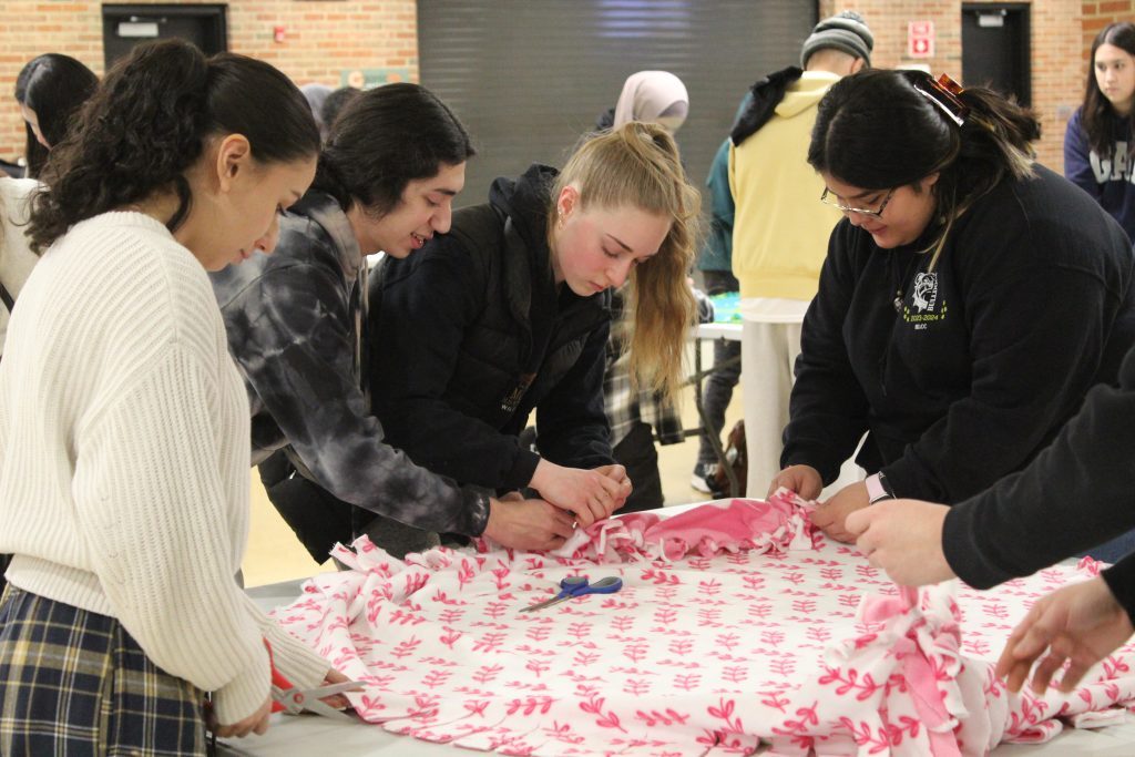 Richards High School students met after school on January 31 at the high school, 10601 Central Avenue in Oak Lawn, to make fleece comfort blankets for pediatric cancer patients at Advocate Hope Children’s Hospital. (Supplied photos)
