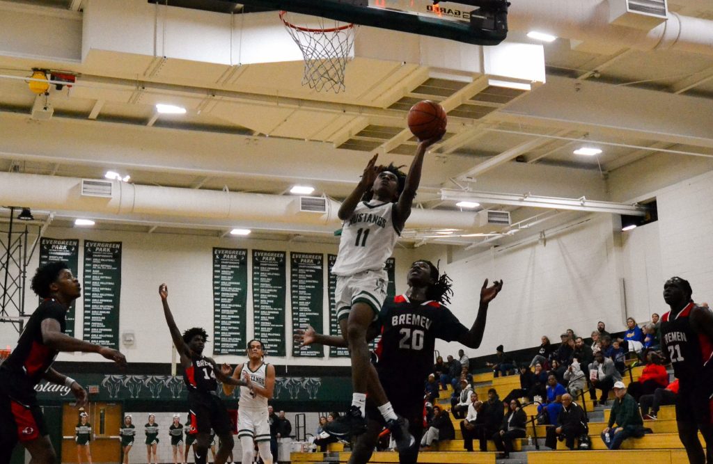 Evergreen Park junior guard Keshaun Crawl-Vaval goes up for a layup during a South Suburban Conference crossover game against Bremen on Jan. 11. Photo by Xavier Sanchez