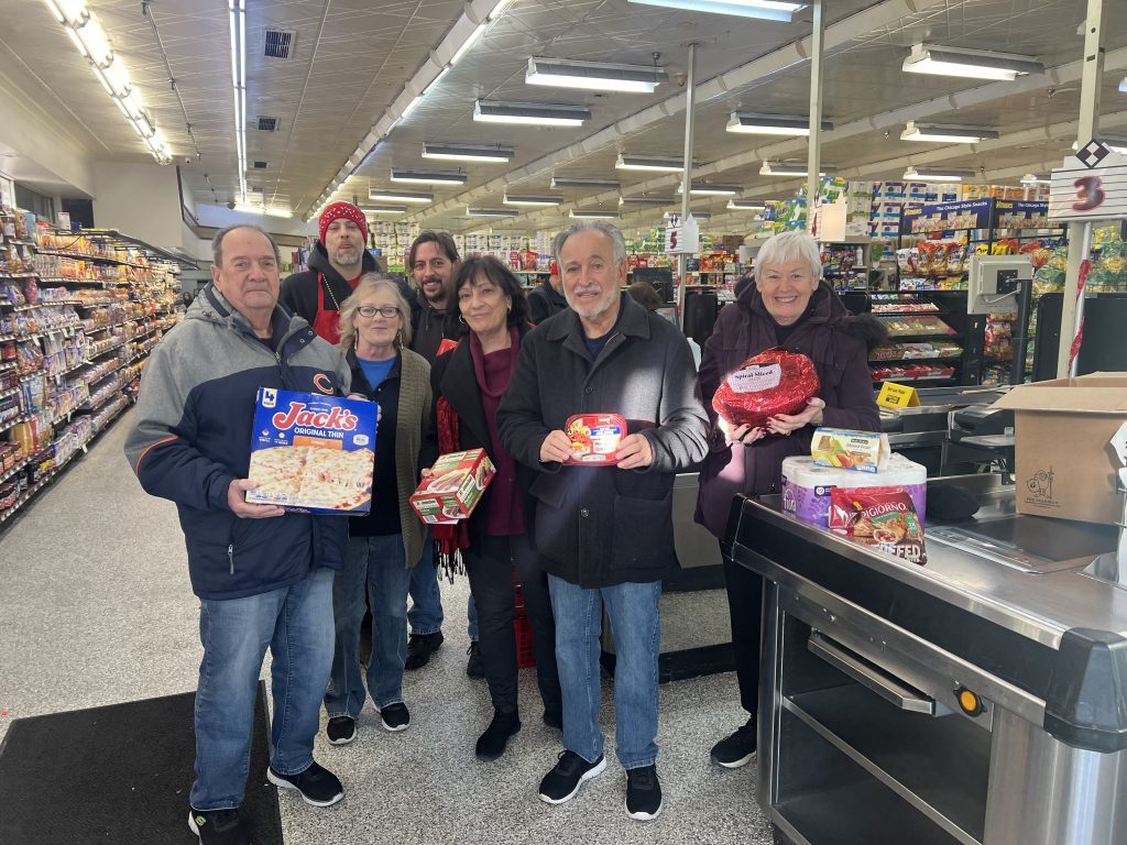 UBAM's 25th Annual Something for Seniors event culminated on Dec. 18 with UBAM board members and Fair Share staff gathering at the store to fill and deliver boxes of food donated to 52 seniors in need on the Southwest Side. --Supplied photo