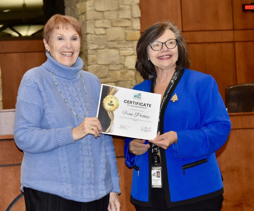 Countryside City Administrator Gail Paul (right) presents Fran Prokop with a certificate of achievement for her 30 years as recording secretary. (Photo by Steve Metsch) 