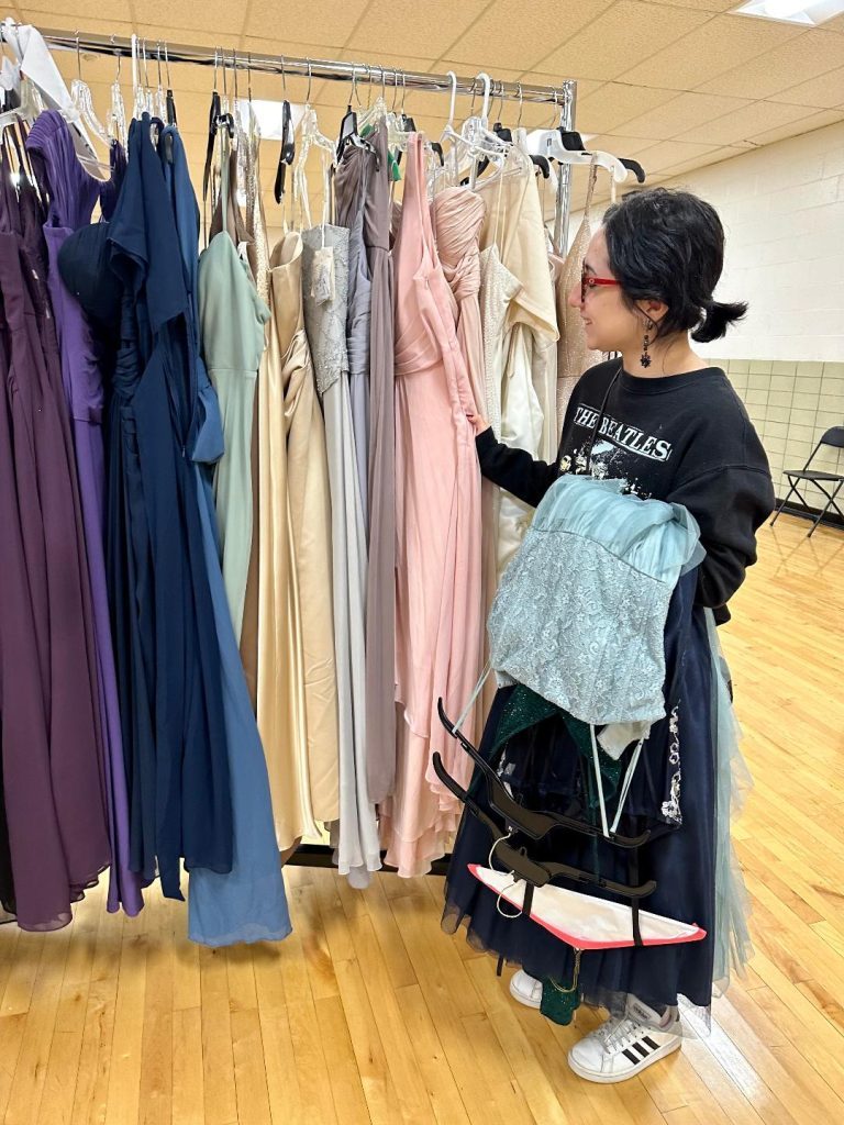 Mia Reyes, 18, of Oak Lawn, browses for prom dresses at Cinderella's Closet at Oak Lawn Community High School. (Photos by Kelly White)