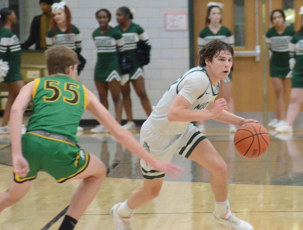 Evergreen Park senior guard Nolan Sexton moves the ball up court against Providence on Feb. 14. Photo by Jeff Vorva