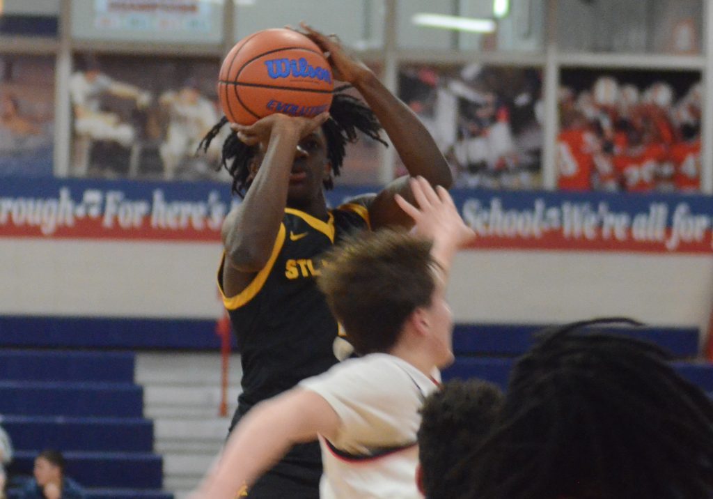 Khalil Jones of St. Laurence lines up a shot against St. Rita in a CCL battle on Jan. 30. Photo by Jeff Vorva 