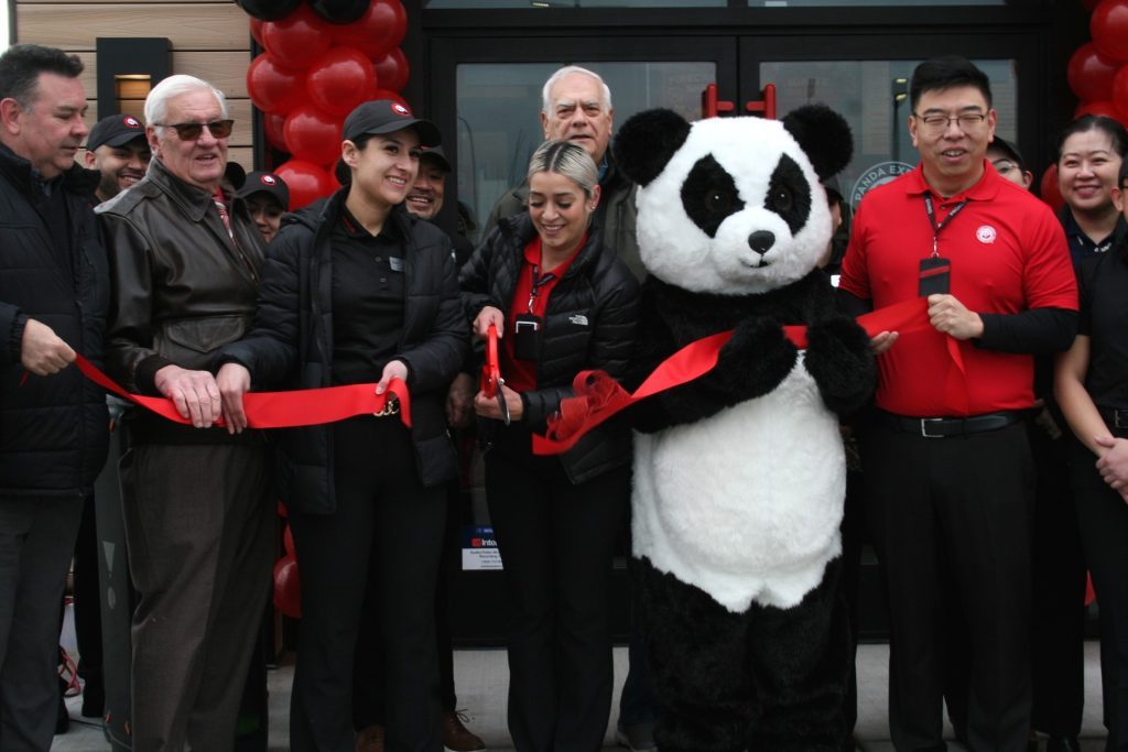 Nancy Diaz, area coach of operations for Panda Express, cuts the ribbon at the new Oak Lawn restaurant on Feb. 15. Joining her for the ceremony were (far left) Oak Lawn Trustee Paul Mallo (3rd) and Mayor Terry Vorderer. Xin Qin, the regional director of operations for the new Panda Express, is at far right. (Photos by Joe Boyle)