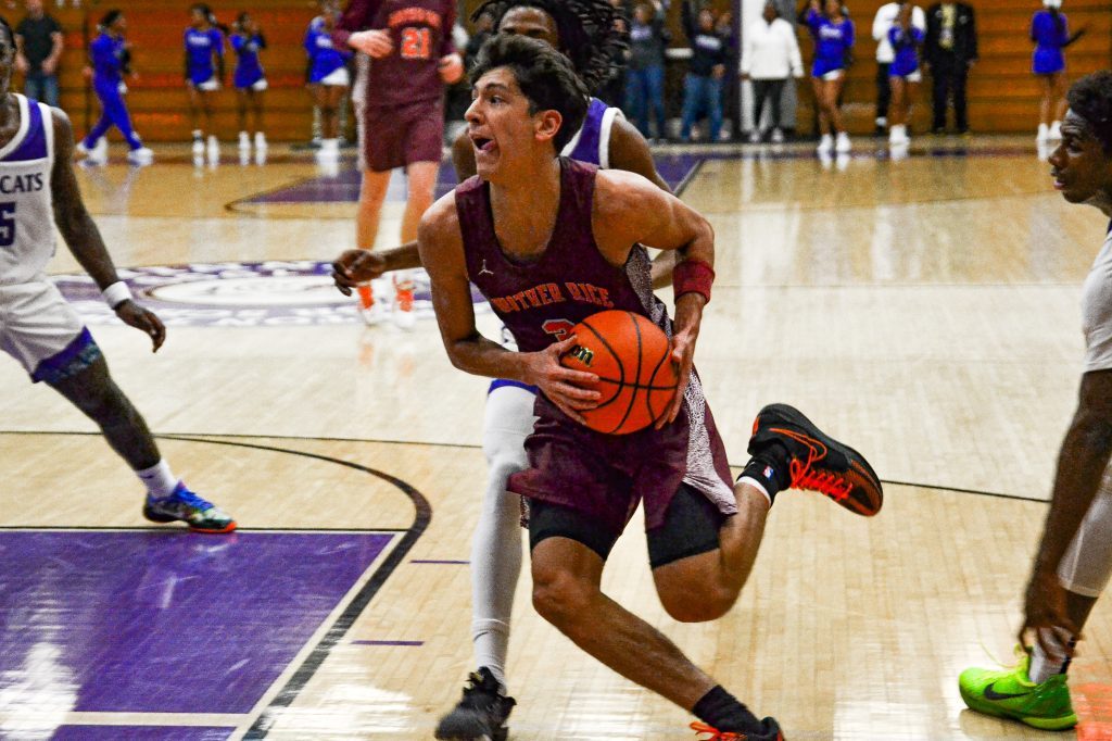 Brother Rice guard Marcos Gonzalez drives to the basket during the Crusaders' loss to Thornton in the IHSA Class 3A Thornton Sectional Final. Photo by Xavier Sanchez