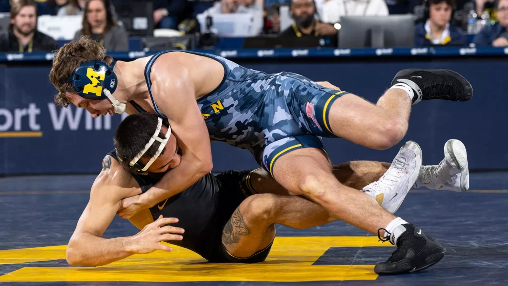 Sergio Lemley (top), who won three state championships at Mount Carmel, finished in fourth place at the Big Ten tournament during his freshman season. Photo courtesy of University of Michigan Athletics