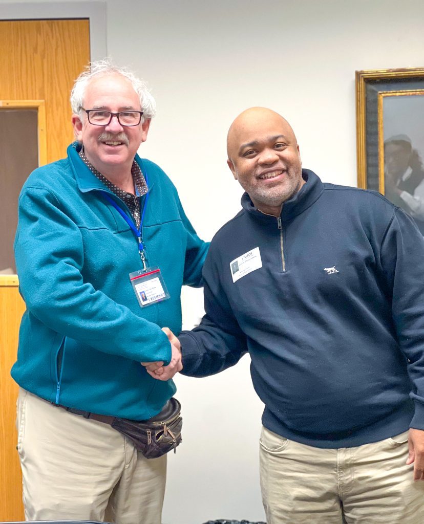 Harold Blackmon (right) is welcomed to De La Salle by Meteors athletic director Tom White. Photo courtesy of De La Salle