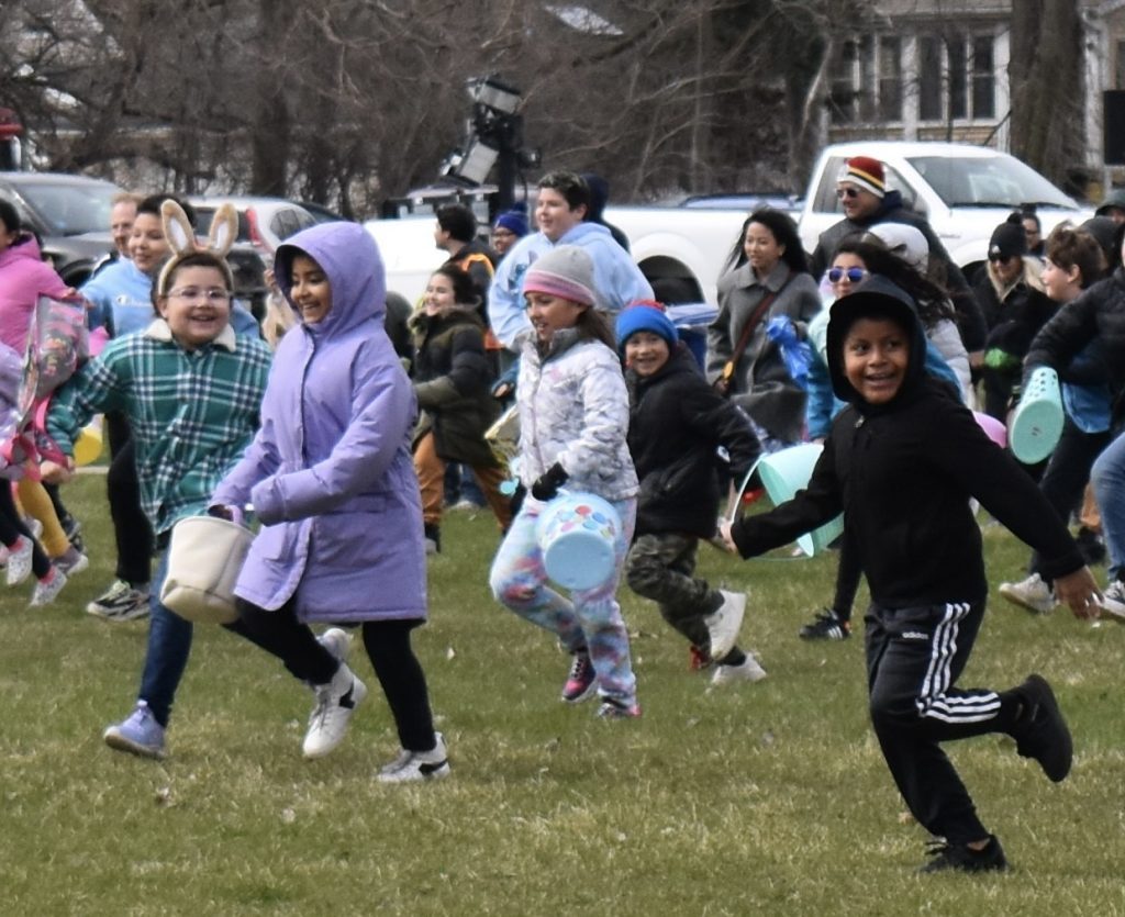 And they’re off! Excited children race to gather plastic eggs at the annual Lyons Easter Egg Hunt held Sunday in Cermak Park. (Photos by Steve Metsch)
