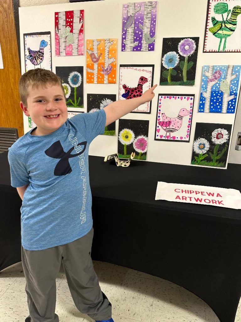 Chippewa Elementary School second-grader, Nicholas Bass, 8, of Palos Heights, proudly showed off his artwork at the 15th annual Arts Extravaganza. (Photos by Kelly White)
