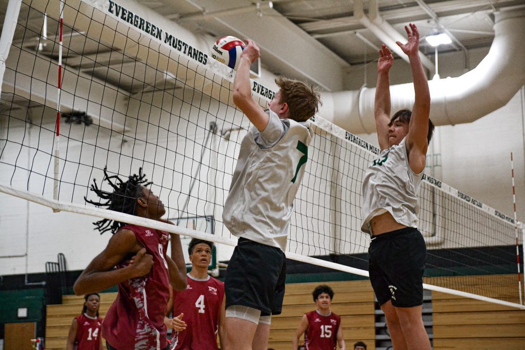 Evergreen Park’s Patrick Maroney blocks a kill attempt during a match against T.F. United on April 18. Photo by Xavier Sanchez