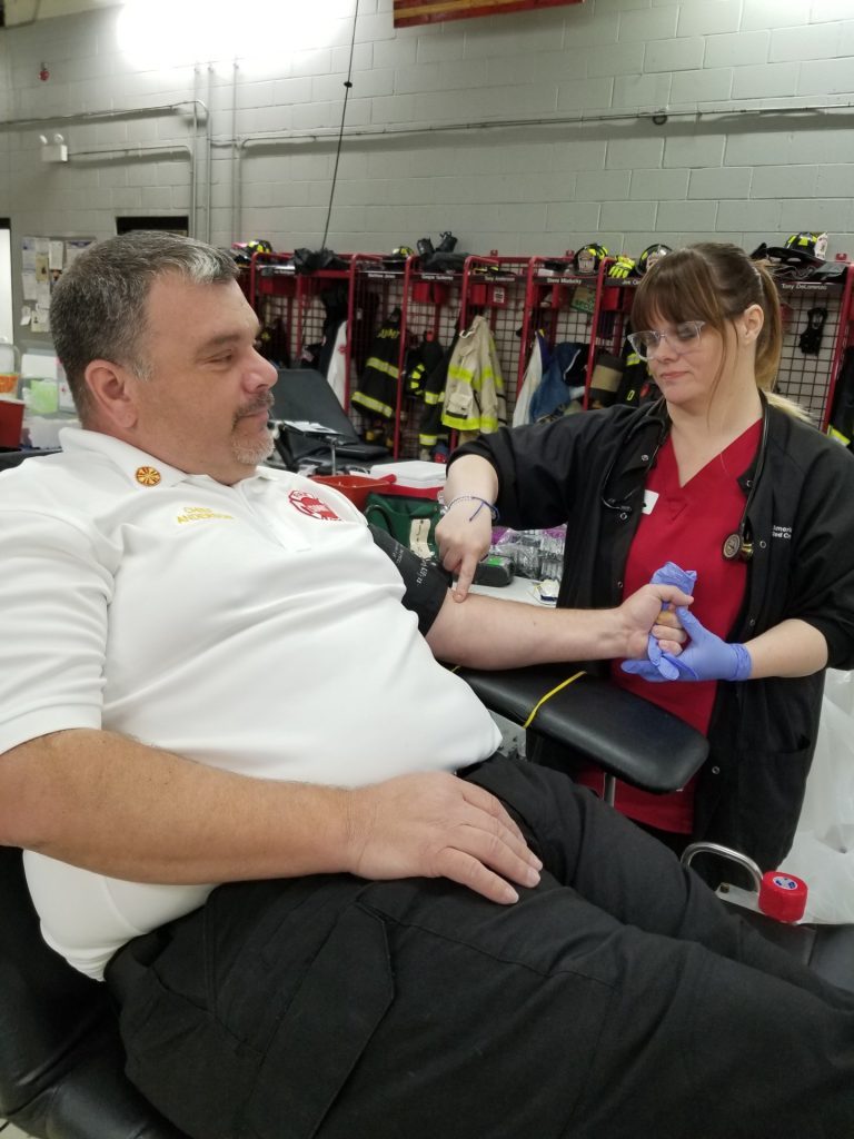 Summit Fire Chief Anthony Anderson was the first to donate blood at the fire department's blood drive. (Photos by Carol McGowan)