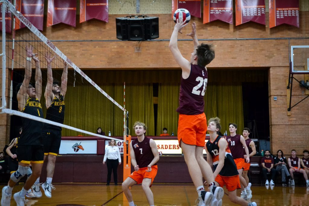 Brother Rice junior Gavin Arnold forces the ball over the net during a match against Richards on April 19. Photo by Xavier Sanchez