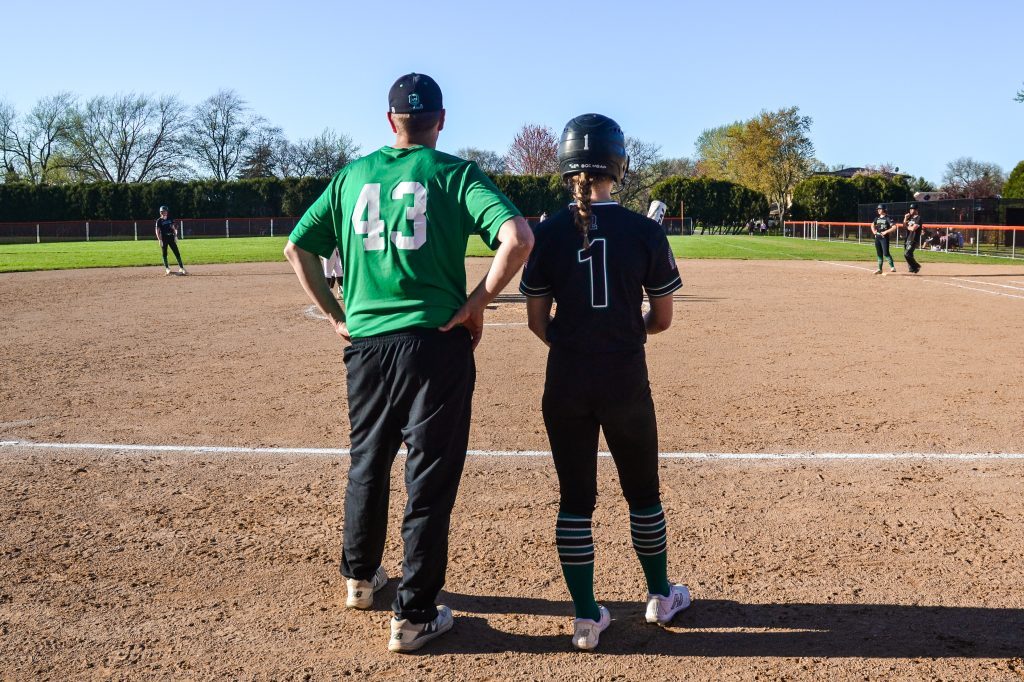 Oak Lawn coach Shawn Neubauer and Teagan Kryzstof survey the field during the Spartans’ 3-0 loss to Shepard on April 15. Photo by Xavier Sanchez