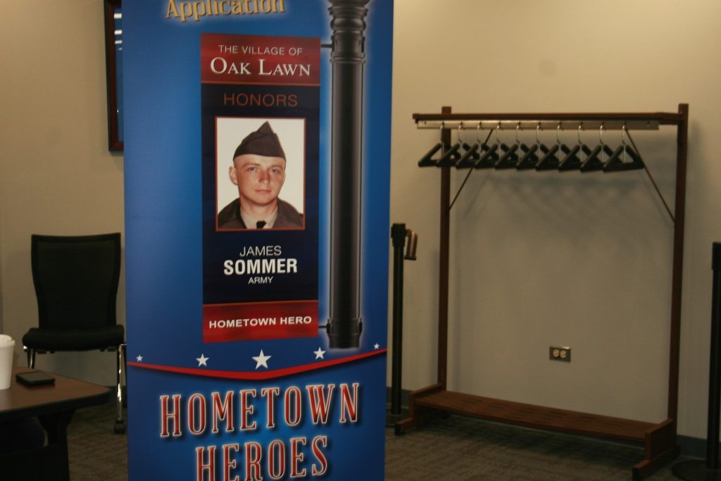 An example of the Hometown Heroes banner was on display at the Oak Lawn Village Board meeting Tuesday morning. The banners will appear throughout the village in designated areas honoring current and former U.S. veterans from Oak Lawn. (Photo by Joe Boyle)