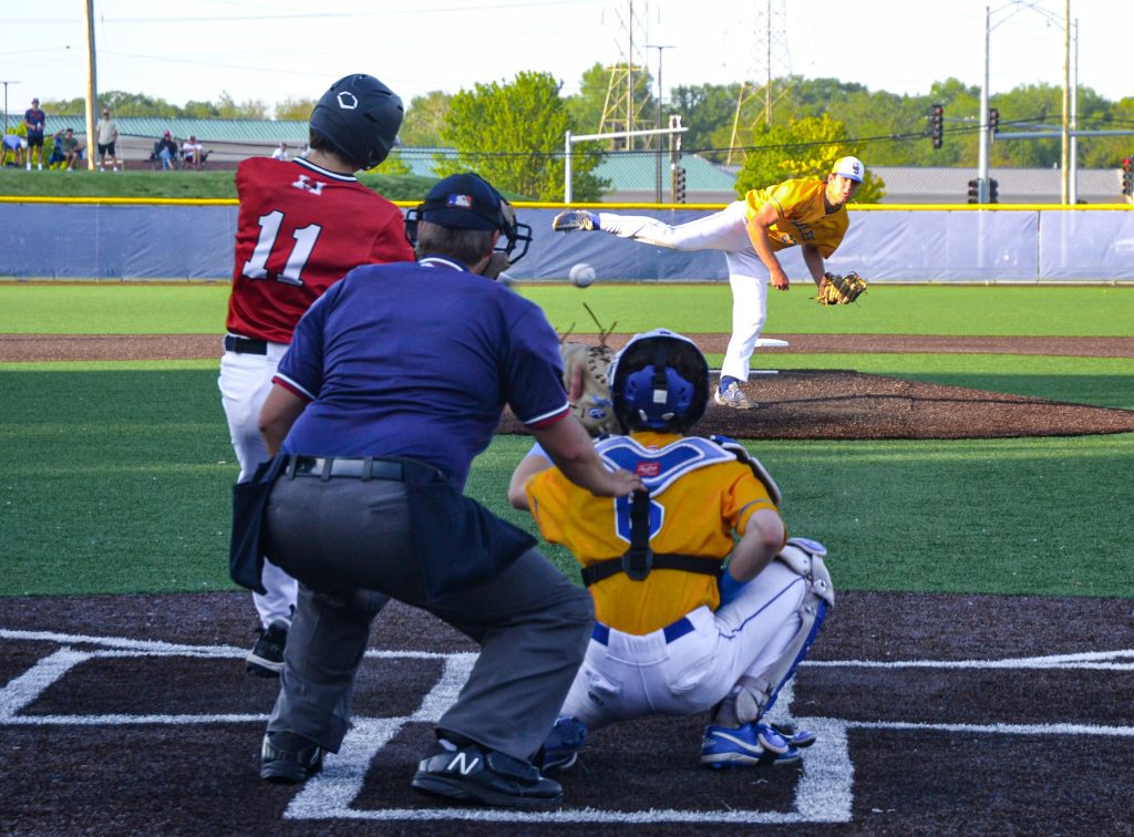 Sandburg pitcher Ethan Highfill gets Marist's Aiden Cech to swing and miss on a pitch during a 7-3 Eagles' victory on May 23. Photo by Xavier Sanchez