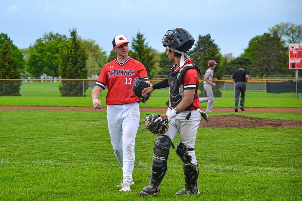 Joey Gumuls fist pumps his starting pitcher Frank Bilecki after avoiding some damage in the first inning. Photo by Xavier Sanchez