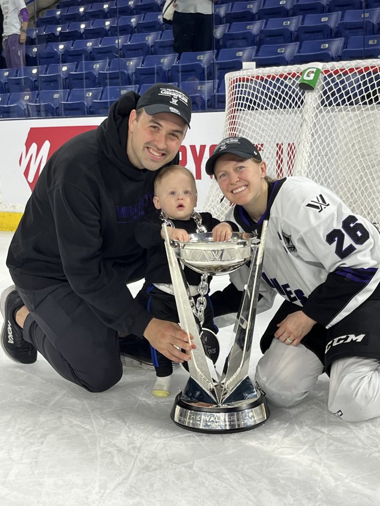 Michael Schofield, Kendall Coyne Schofield and their son, Drew, with the Walter Cup won by Coyne Schofield and her teammates on the Professional Women’s Hockey League’s Minnesota team. Photo courtesy of the Schofield family
