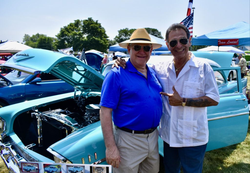 Bruce Quintos (right) visits with Lyons Village Trustee Dan Hilker in front of Quintos’ 1957 Chevy Bel Air that he lovingly restored. (Photos by Steve Metsch)